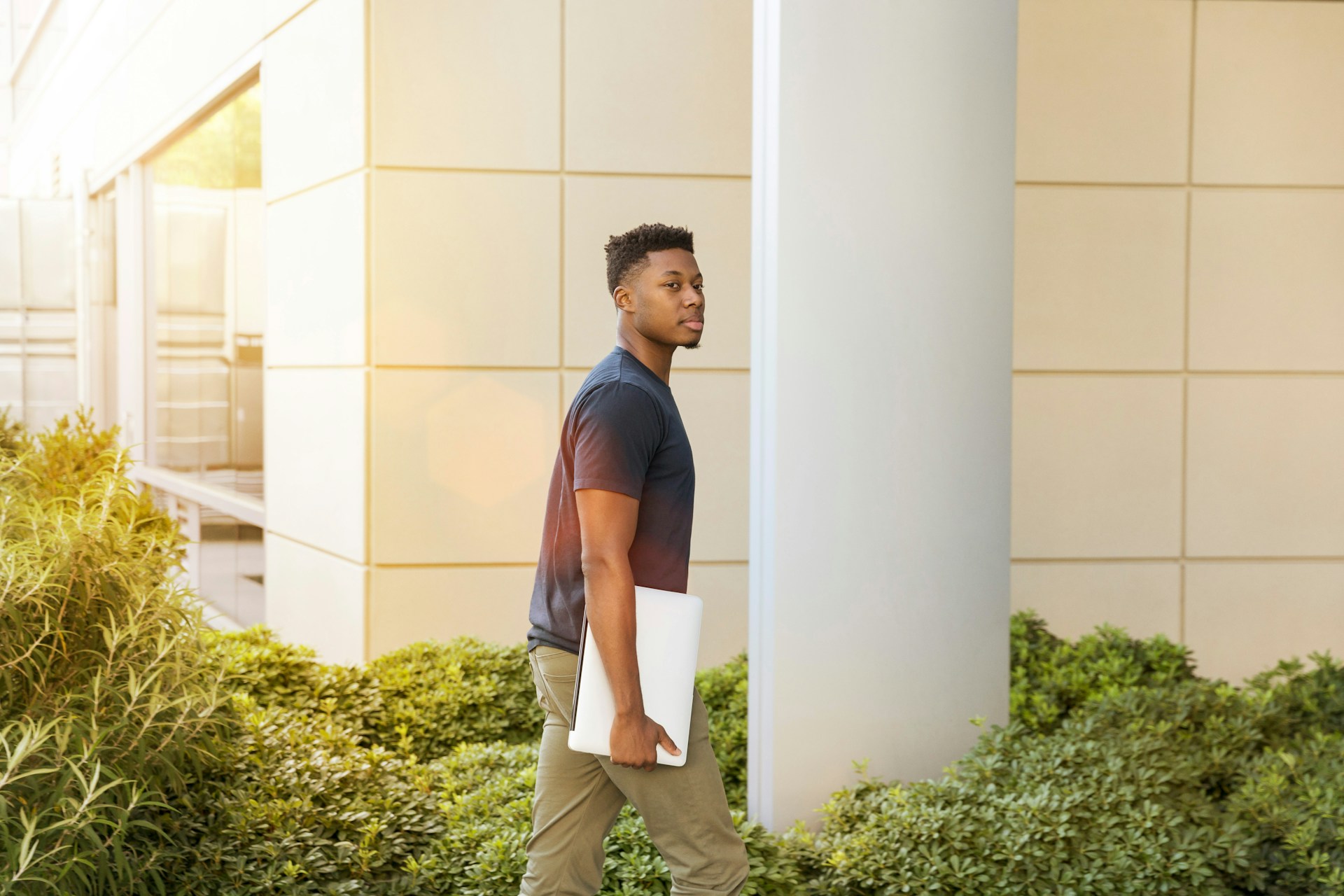 Intern walking outside an office building